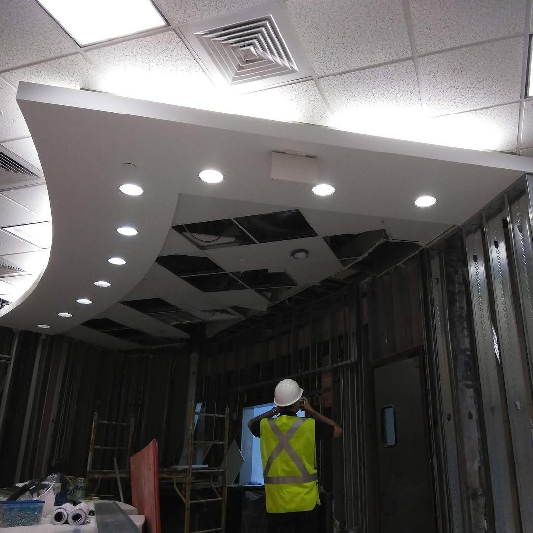 Commercial interior under construction with new ceiling lighting