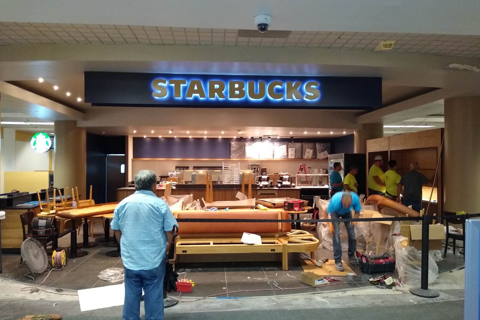 Crew installing millwork at a Starbucks counter